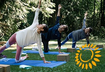 AISCS Sustainability group practicing yoga outside