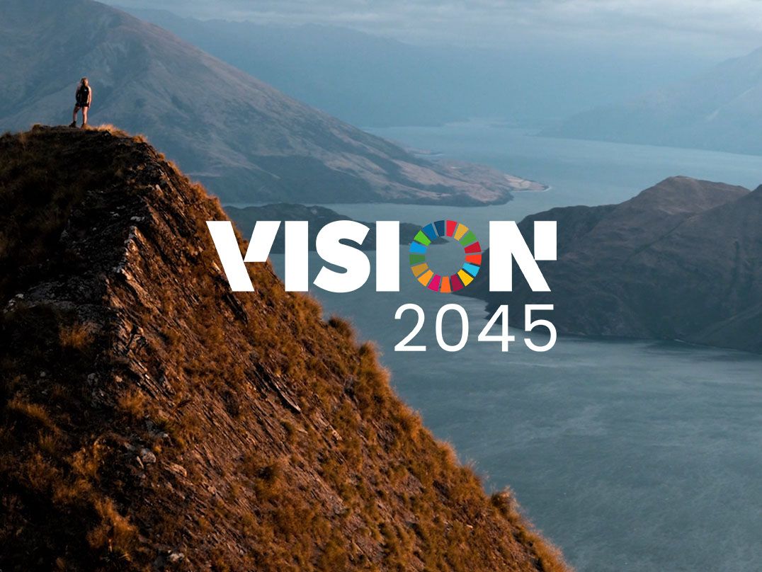 A picturesque scene of a mountain with the Vision 2045 logo front and center
