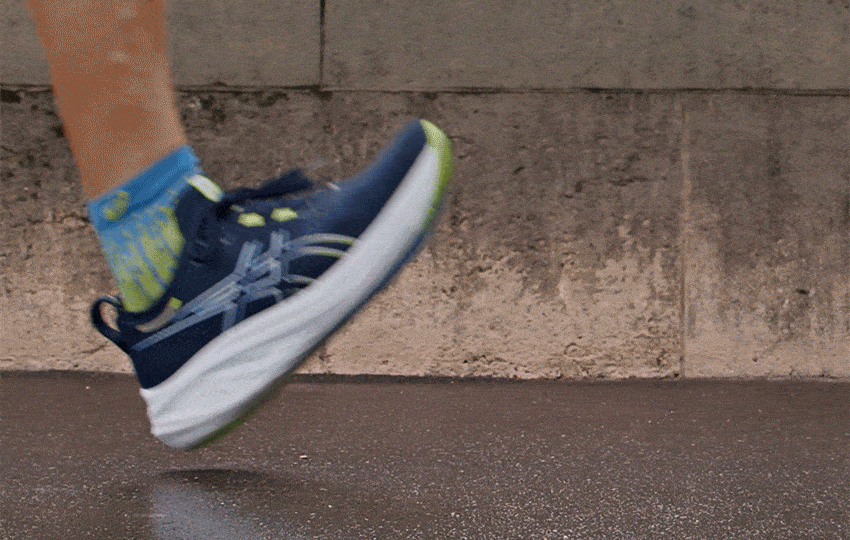 Close-up shot of a male runner running in the Nimbus™ 26 shoe