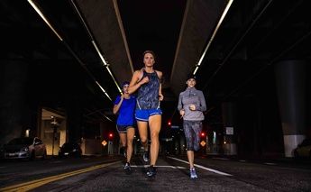 three women running at night; lite-show