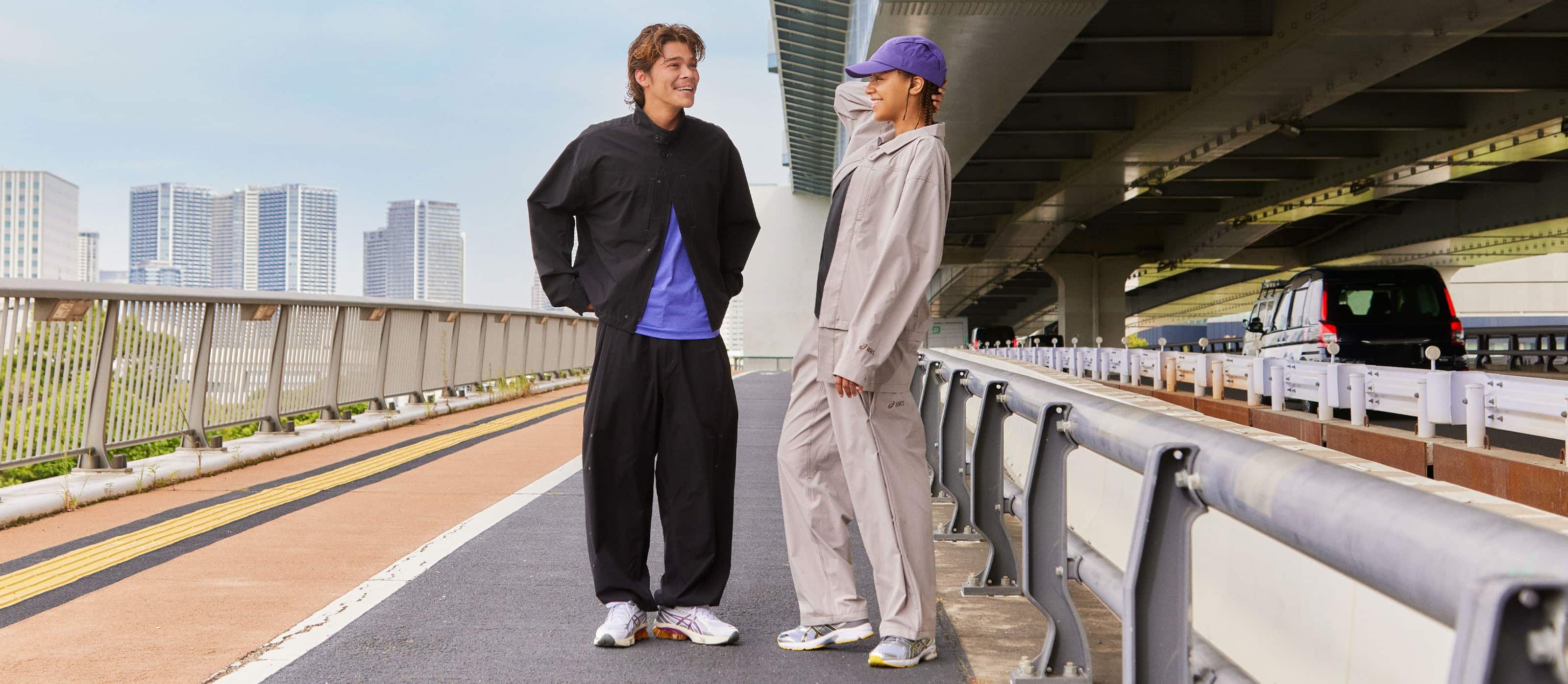 A male and female model wear the new SS25 SPS Apparel Collection.