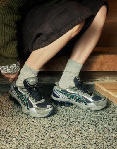 close up of woman wearing gel-kinetic asics sneakers