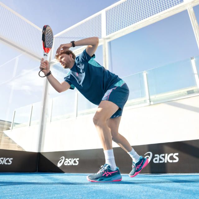 Athlete playing padel wearing blue asics apparel