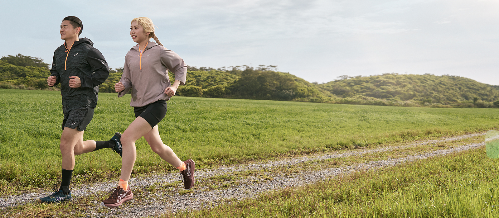 Man and Woman running wearing Nature Bathing Collection