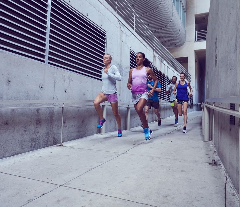 group of runners through cement hallway