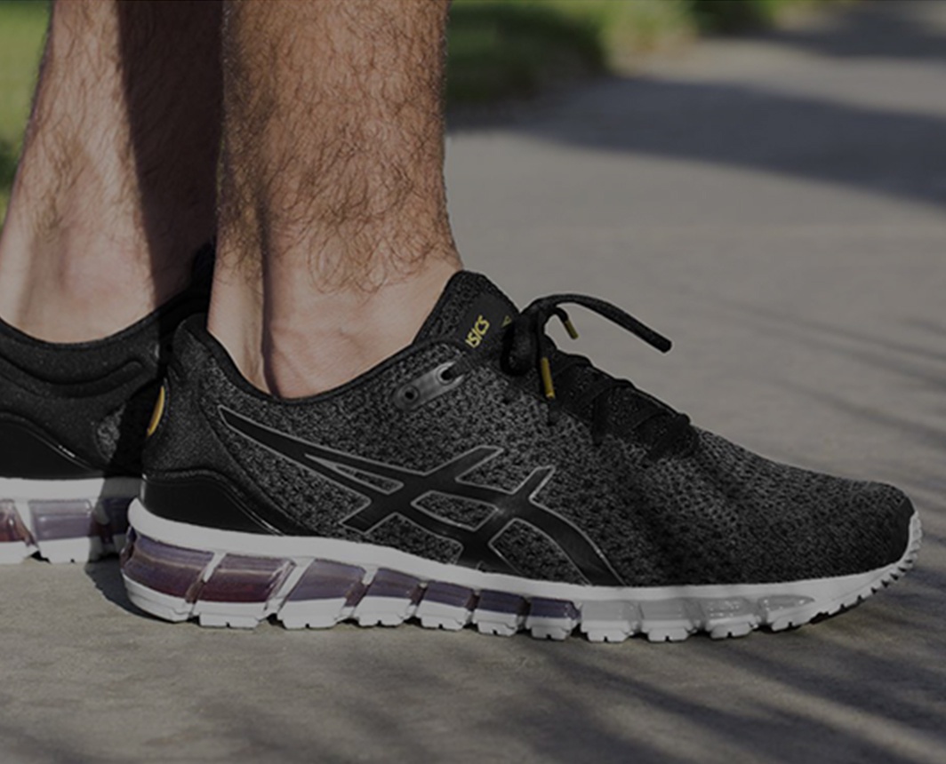 Closeup of men’s black running shoes.