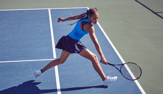 woman in blue playing tennis