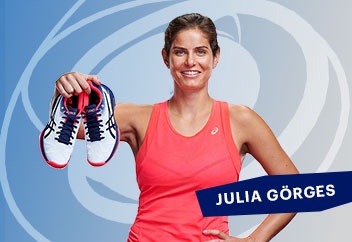 Julia Goerges holding a pair of tennis shoes