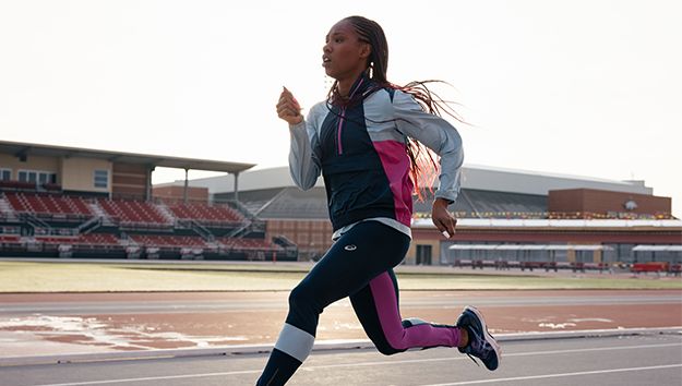 Kiara Parker running on an outdoor track.