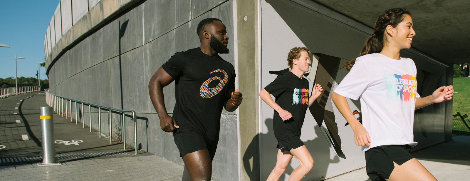 Three athletes running outdoors wearing ASICS celebration of sport footwear and apparel 