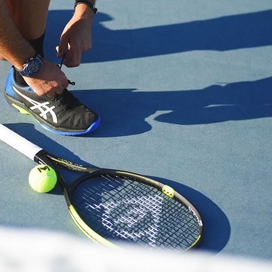 Tennis racket on ground