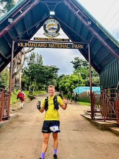 Dan wearing Fuji Trail Pack entering Kilimanjaro National Park